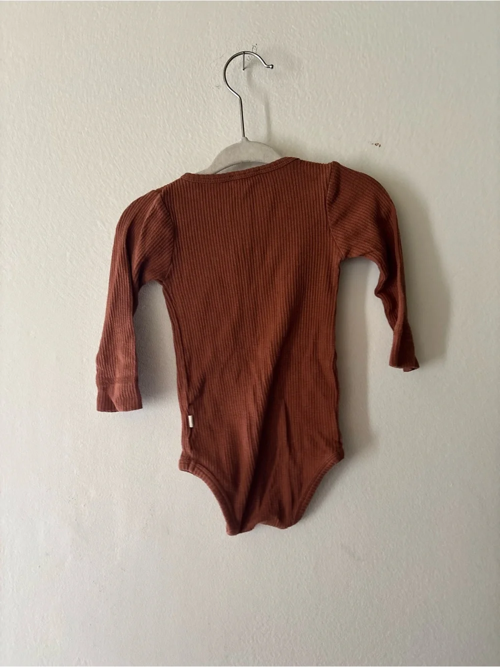 Jamie Kay Ribbed One-Piece Bodysuit in Rust Brown
